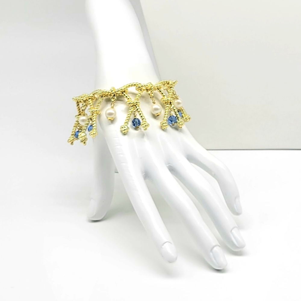 Heidi Daus Twisted Gold Knot Bracelet with White Glass Pearl + Sapphire Crystal